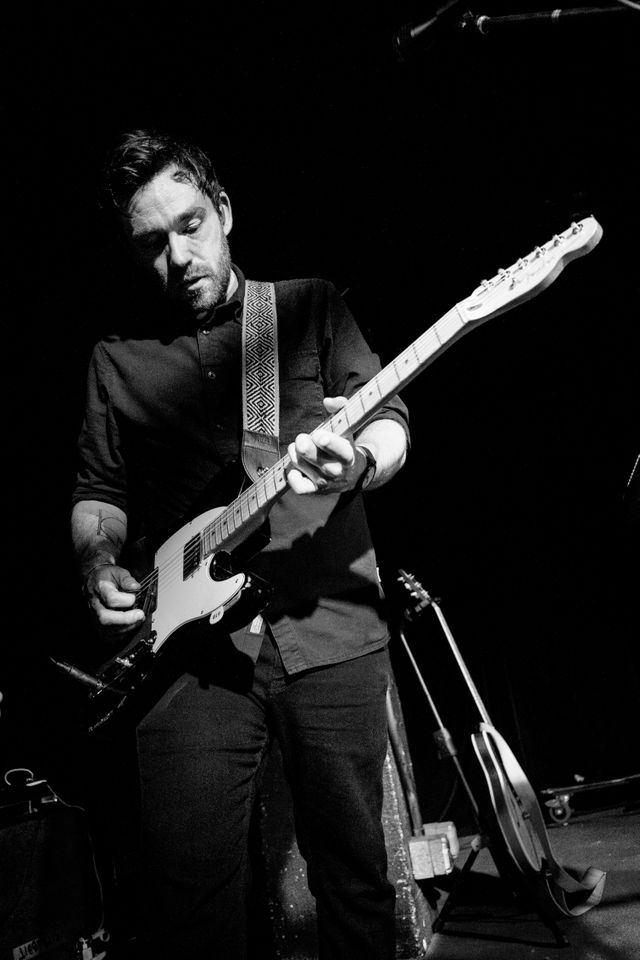 Billy Kennedy playing guitar at a Frightened Rabbit concert at Black Cat.