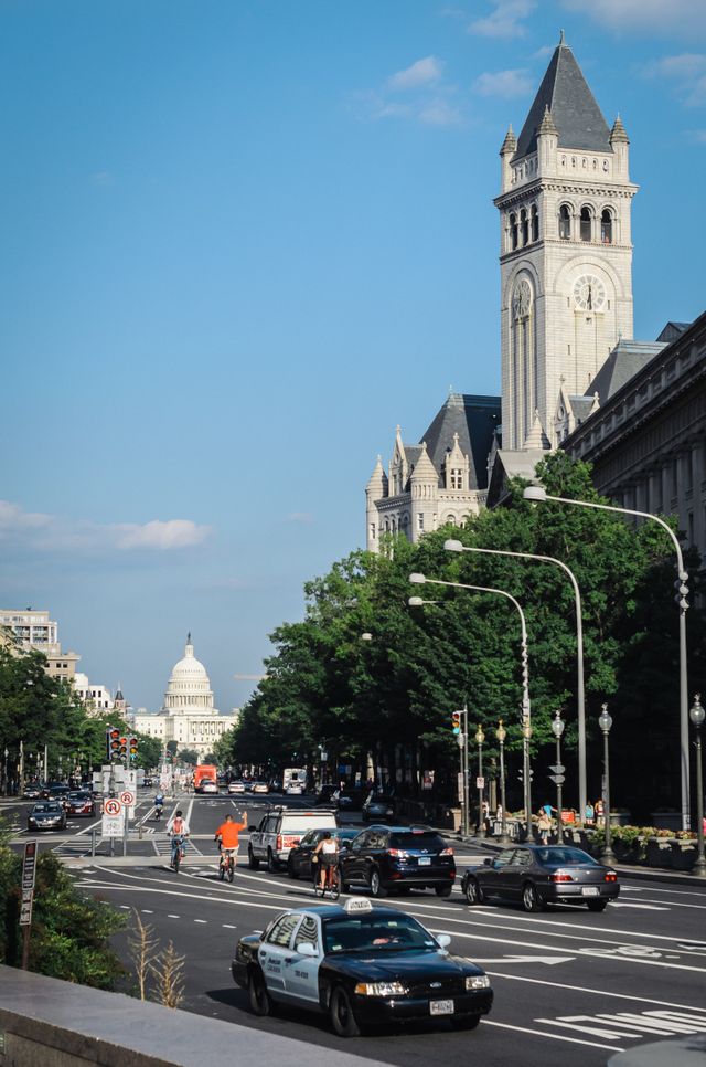 View of Pennsylvania Avenue, the Old Post Office, and the United States Capitol, from Freedom Plaza in Washington, DC.