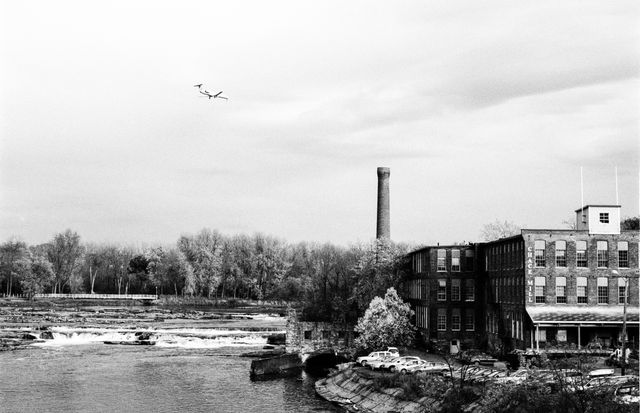 A plane flying over Winooski, Vermont.