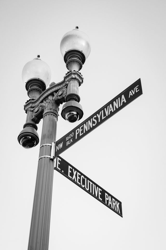 A street sign on Pennsylvania Avenue, in front of the White House.