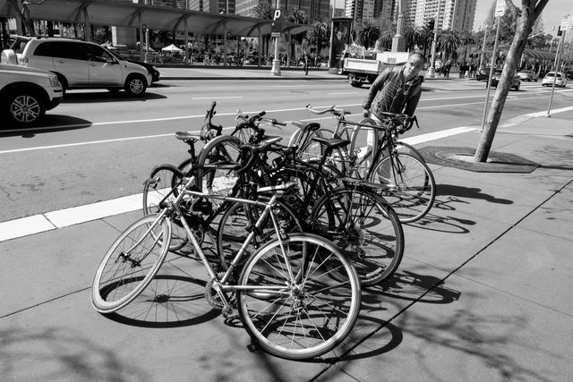 A pile of bikes chained to a bike rack at the Embarcadero, San Francisco.