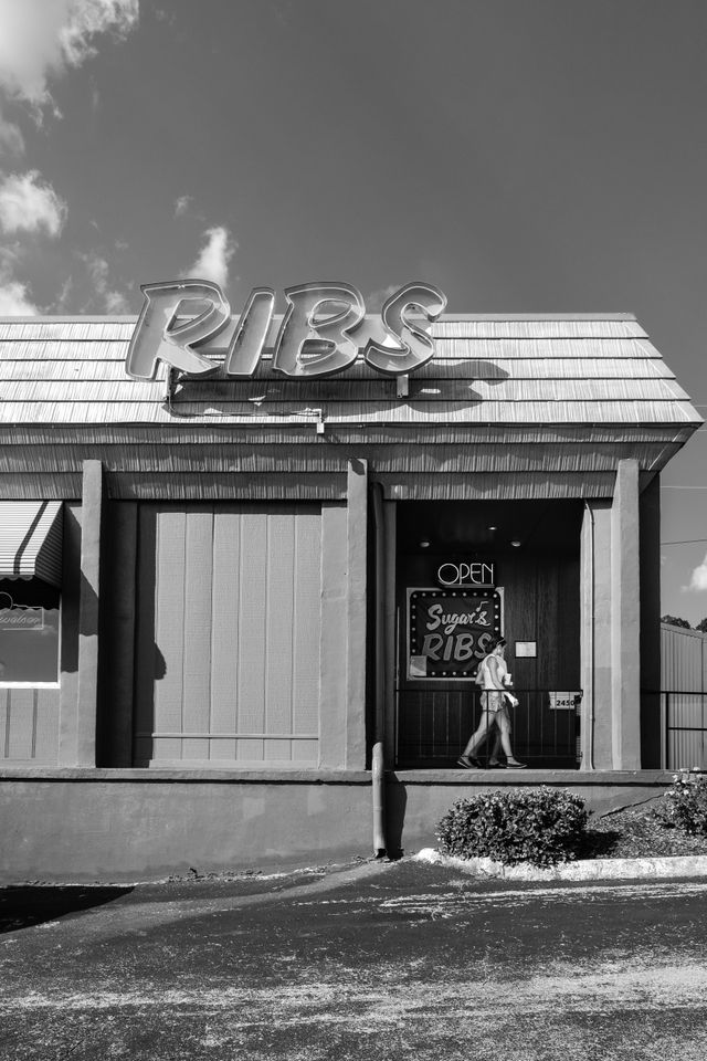 People leaving Sugar's Ribs in Chattanooga, Tennessee.