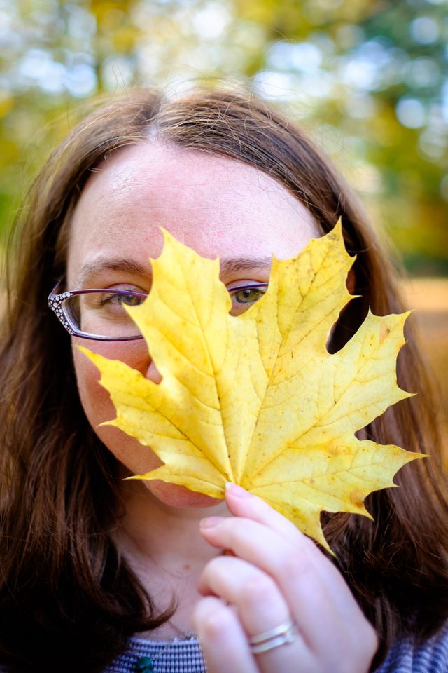 Kate holding up a leaf.