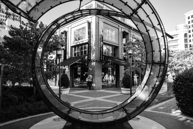 A man seen through a sculpture in downtown Chattanooga.