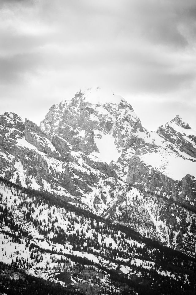 Grand Teton beneath dark clouds.