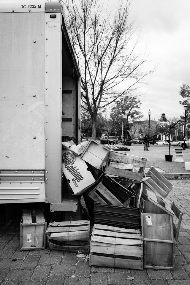 Boxes and crates spilling out of a truck at Eastern Market.