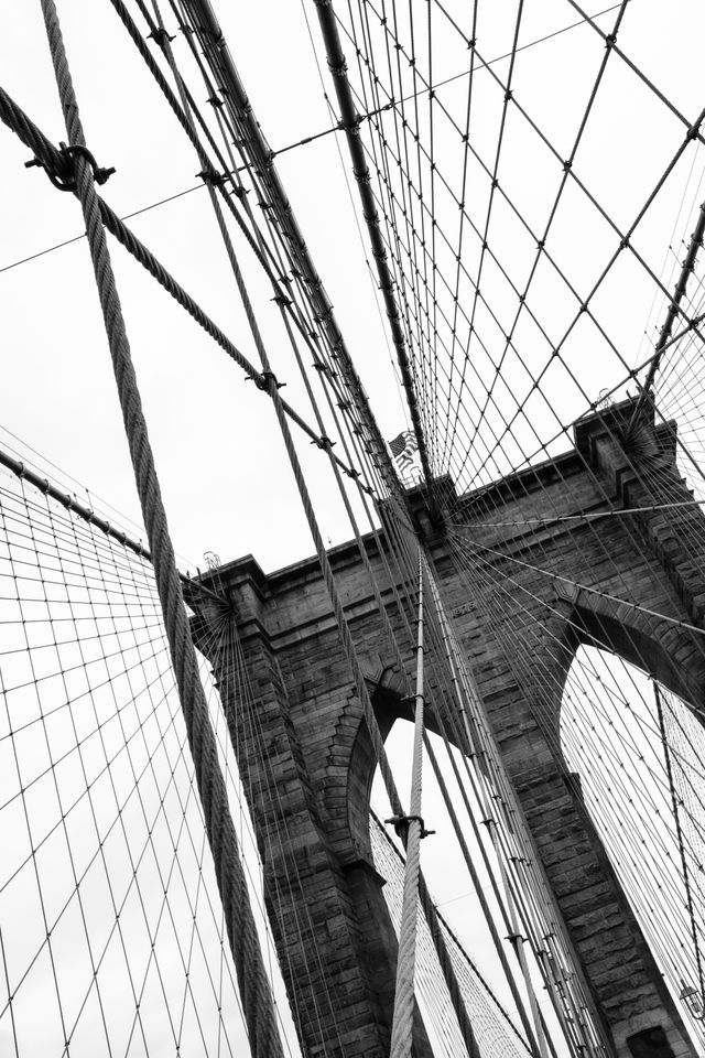 The United States flag at the top of one of the towers of the Brooklyn Bridge.