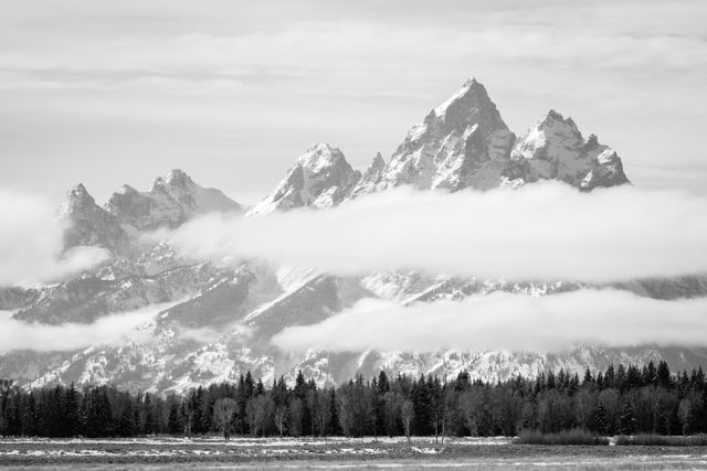 The Teton Range, partially covered by clouds, from Elk Ranch Flats