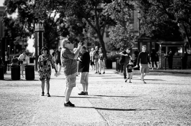 A tourist taking a photo of the Washington Monument at the National Mall.