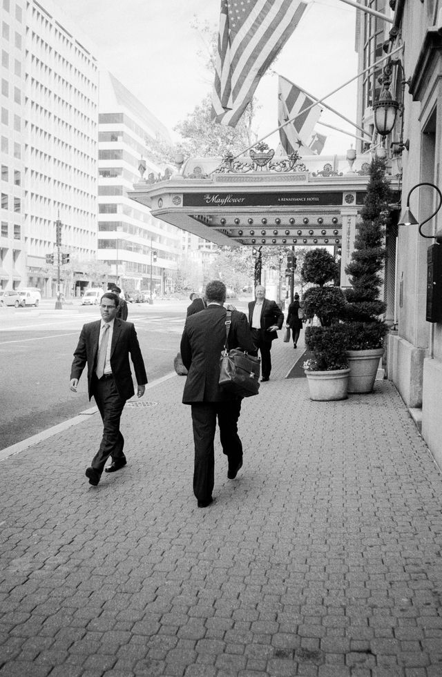 People walking in front of the Mayflower Hotel on Connecticut Avenue NW.