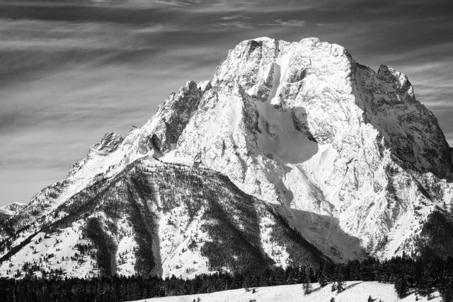 A close-up of a snow-covered Mount Moran in winter.