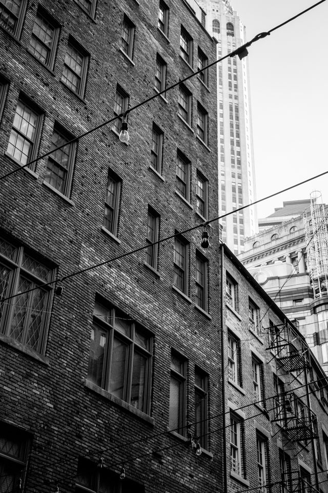 Old brick buildings and fire escapes on Stone Street in the Financial District of New York.