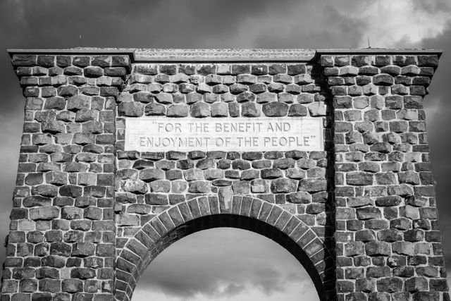 The inscription at the top of the Roosevelt Arch in Yellowstone National Park, which reads "for the benefit and enjoyment of the people".