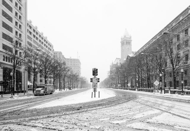 Pennsylvania Avenue, covered in snow, and looking towards the United States Capitol from Freedom Plaza.