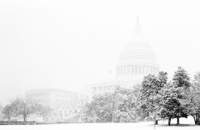 The United States Capitol in the snow.