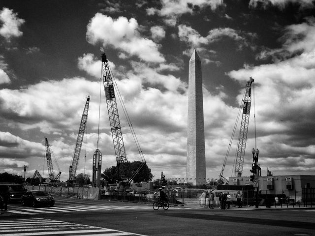 The Washington Monument, and a bunch of construction cranes at the National Museum of African American History and Culture construction site.