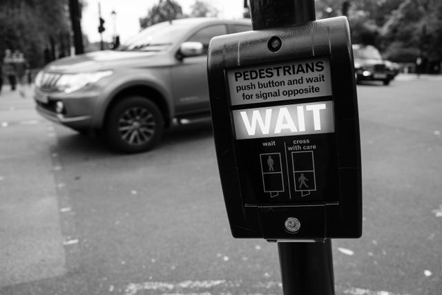 A pedestrian crossing wait sign.