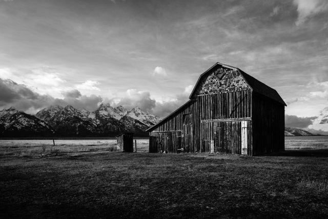 The Joseph Heninger Barn at Mormon Row, seen at sunset. In the backround, the Teton range.