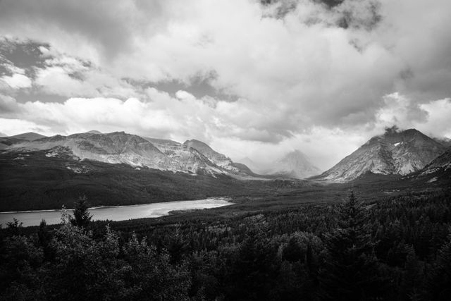 Lower Two Medicine Lake, Rising Wolf Mountain, Appistoki Peak, and a partially-visible Sinopah Mountain, seen from Looking Glass Hill.