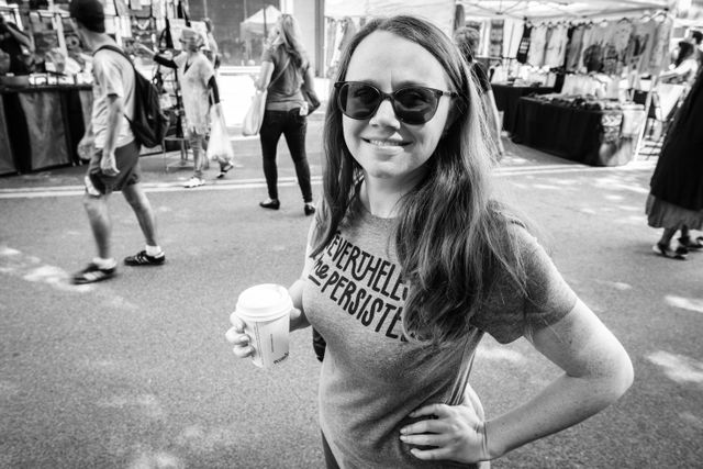 Kate, drinking a cappuccino at Eastern Market.