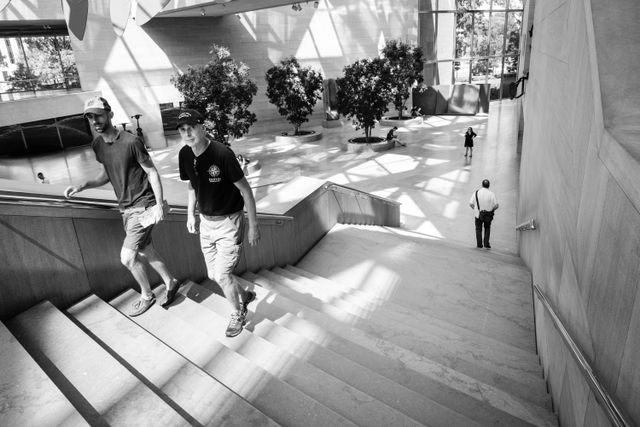 People climbing stairs at the East Building of the National Gallery of Art.