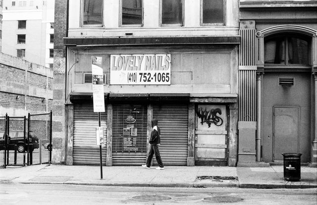 A person walking in downtown Baltimore.