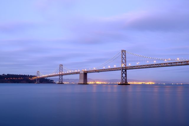 The San Francisco-Oakland Bay Bridge at dusk, from the Embarcadero.