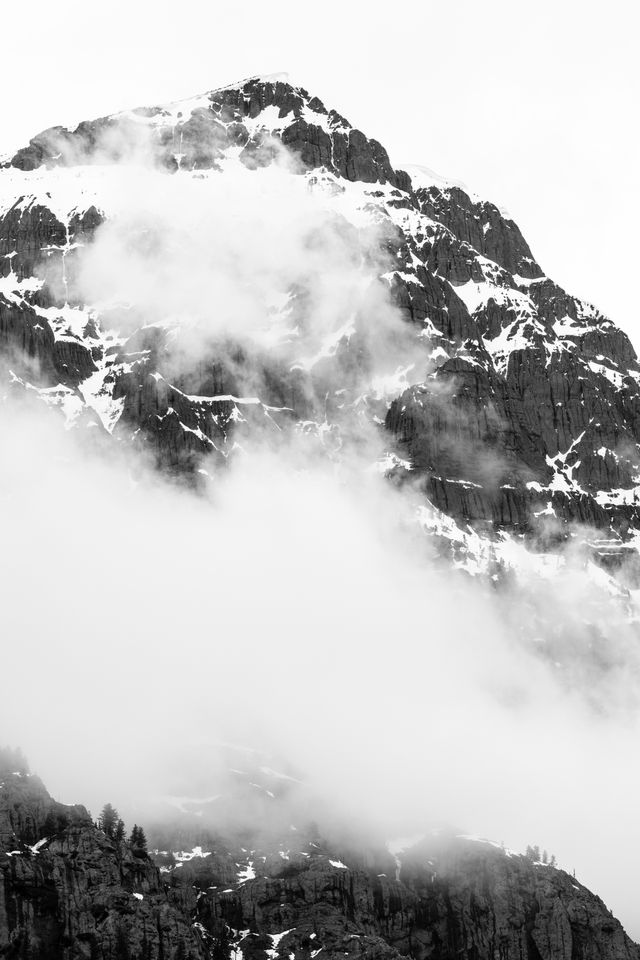 Barronette Peak in Yellowstone National Park, shrouded in clouds.