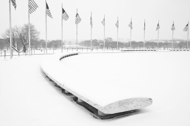 The base of the Washington Monument, covered in snow.