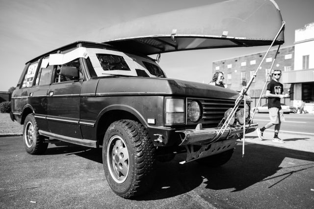 A Range Rover with eclipse glasses on the windshield, at Starr Mountain Outfitters in Etowah, Tennessee.