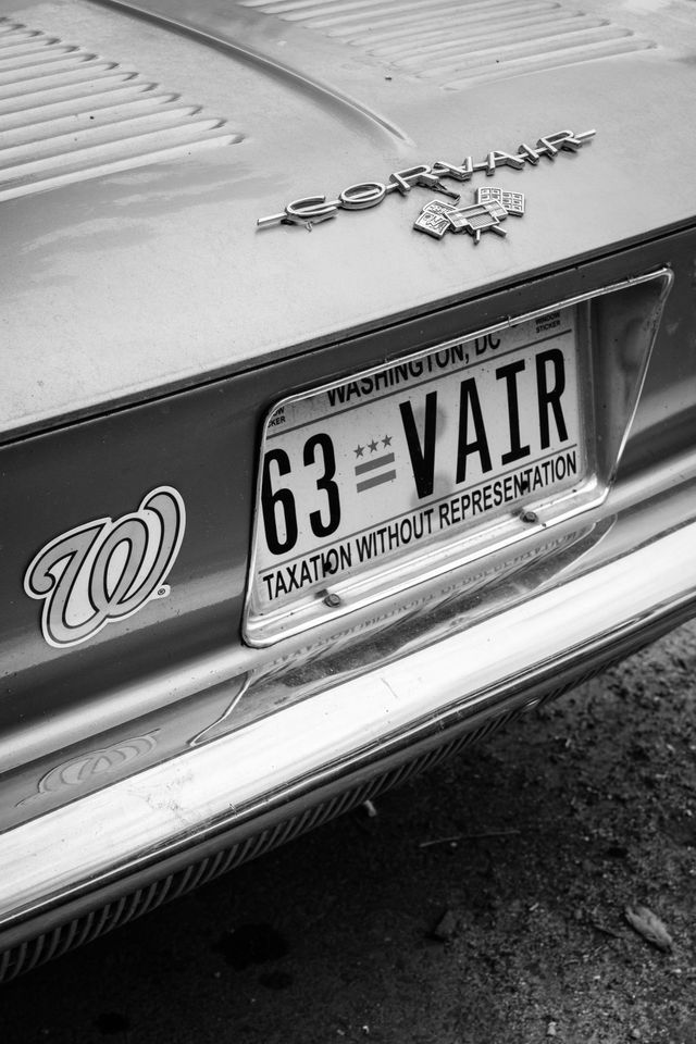 The rear end of a 1963 Convair with DC plates and a Washington Nationals magnet.