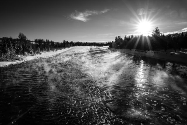 Steam rising from the Snake River at sunset.