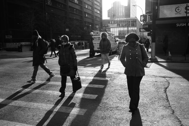 People crossing the street on Broadway & Cortland.