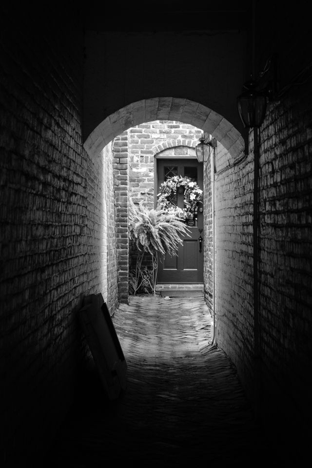 A door at the end of a narrow alley in Fredericksburg, Virginia.