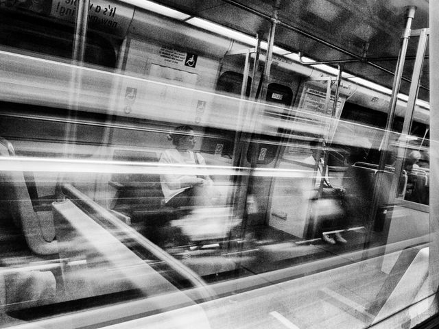 A woman reflected on the window of a Washington, DC Metro train.