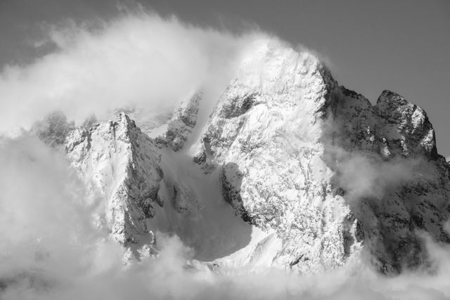 Close-up of Mount Moran's summit, shrouded in clouds.