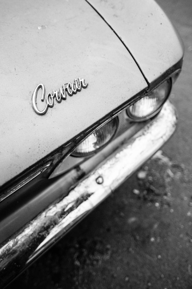 Close up of the badge on the hood of a Chevrolet Corvair parked near Eastern Market in Washington, DC.