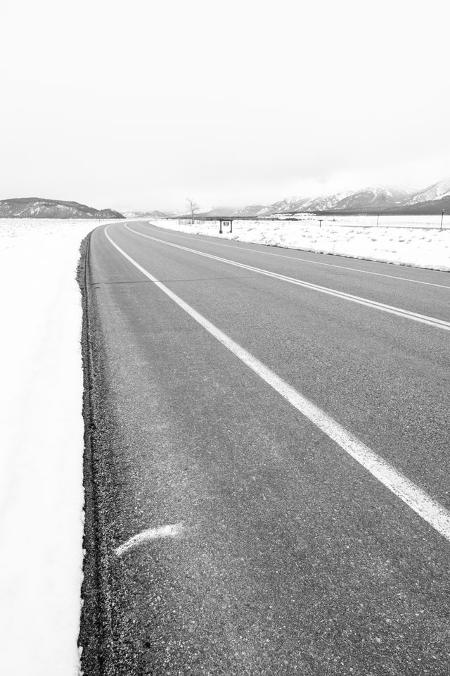 The road next to Teton Point Turnout, looking south towards Moose.