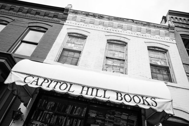 Capitol Hill books in Eastern Market, showing its second-story windows completely covered in books.