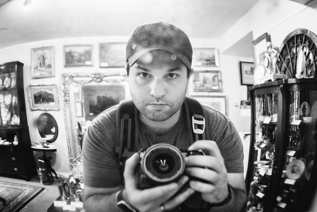 Self-portrait of myself in front of a mirror at an antique shop.