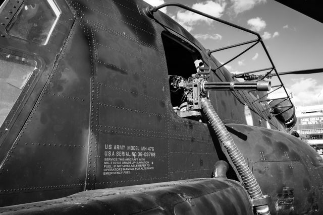 A minigun on the side of an MH-47G Chinook helicopter at the DC Armory.