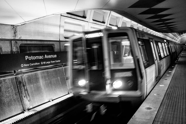 An Orange line train entering the Potomac Avenue Metro Station.