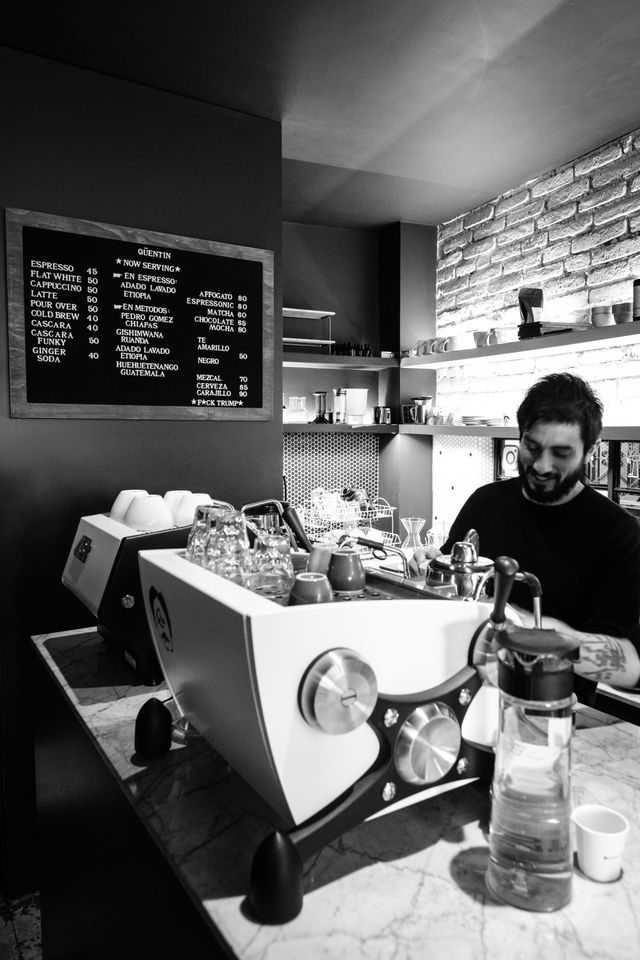 A barista brewing coffee at Café Quentin in Mexico City.