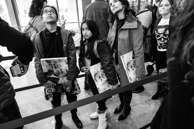 People standing in line to get their Obama books signed by Pete Souza, at the Newseum in Washington, DC.