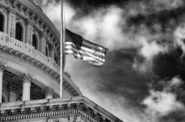 The flag at half staff at the Capitol.