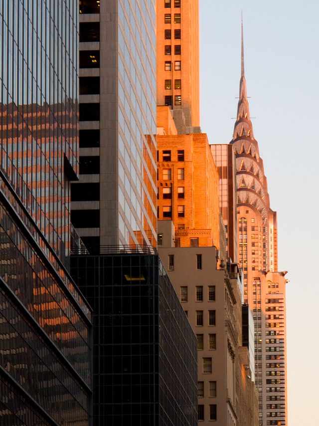 The Chrysler Building, bathed in lovely golden hours colors, taken near the corner of 7th Ave. & W 42nd St.