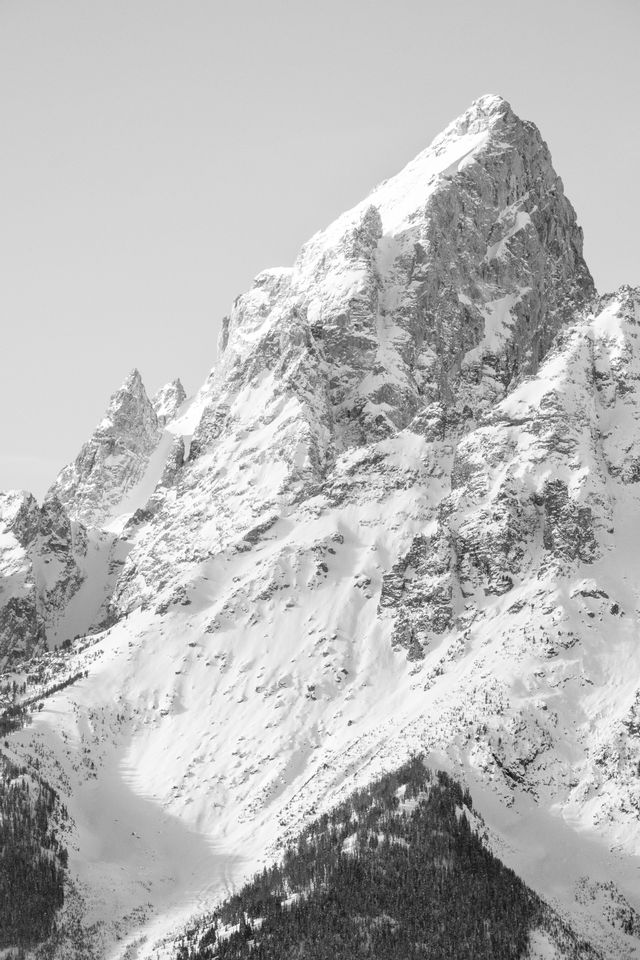 The snow-covered summit of Grand Teton, from the Snake River Overlook.