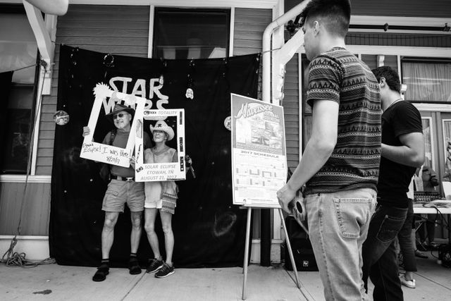 People posing in front of a Star Wars backdrop during the 2017 solar eclipse in Etowah, Tennessee.