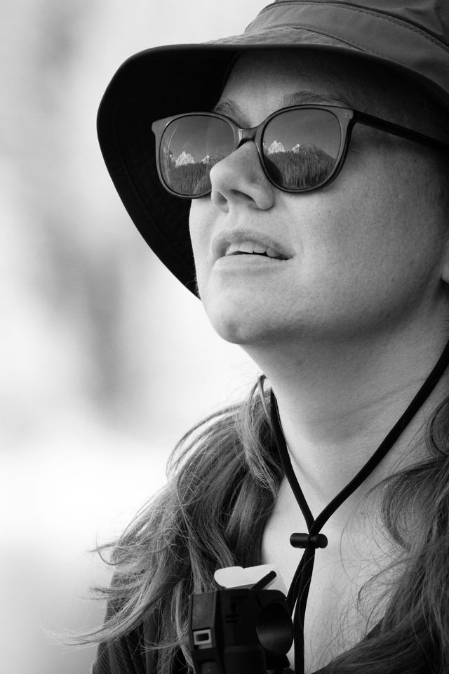 Portrait of Kate, enjoying the views at Bradley Lake. The Tetons are reflected in her sunglasses.