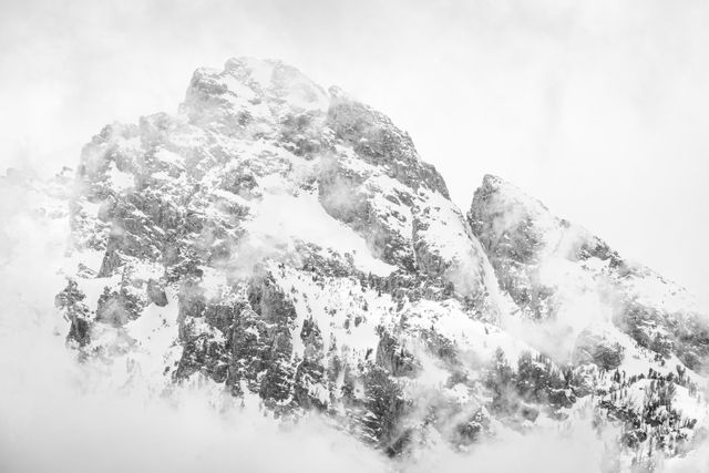 Nez Perce Peak, surrounded by clouds.